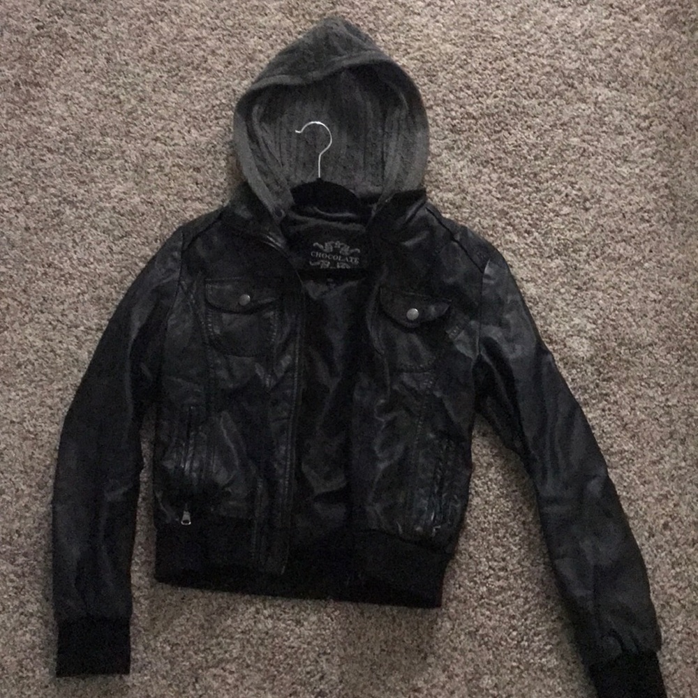 Black leather jacket with detachable knitted hood.
